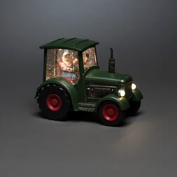 Vannfyllt traktor med bonde